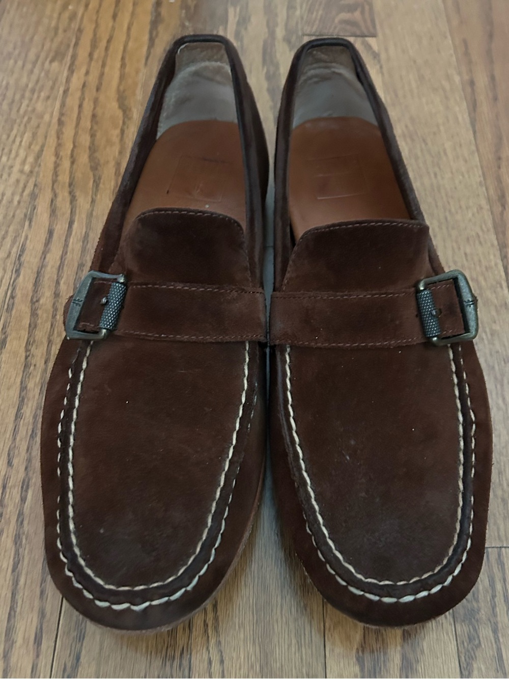 Frye Men’s Brown Suede Slip-On Loafers with Buckle. Model is Harris, Buckle.